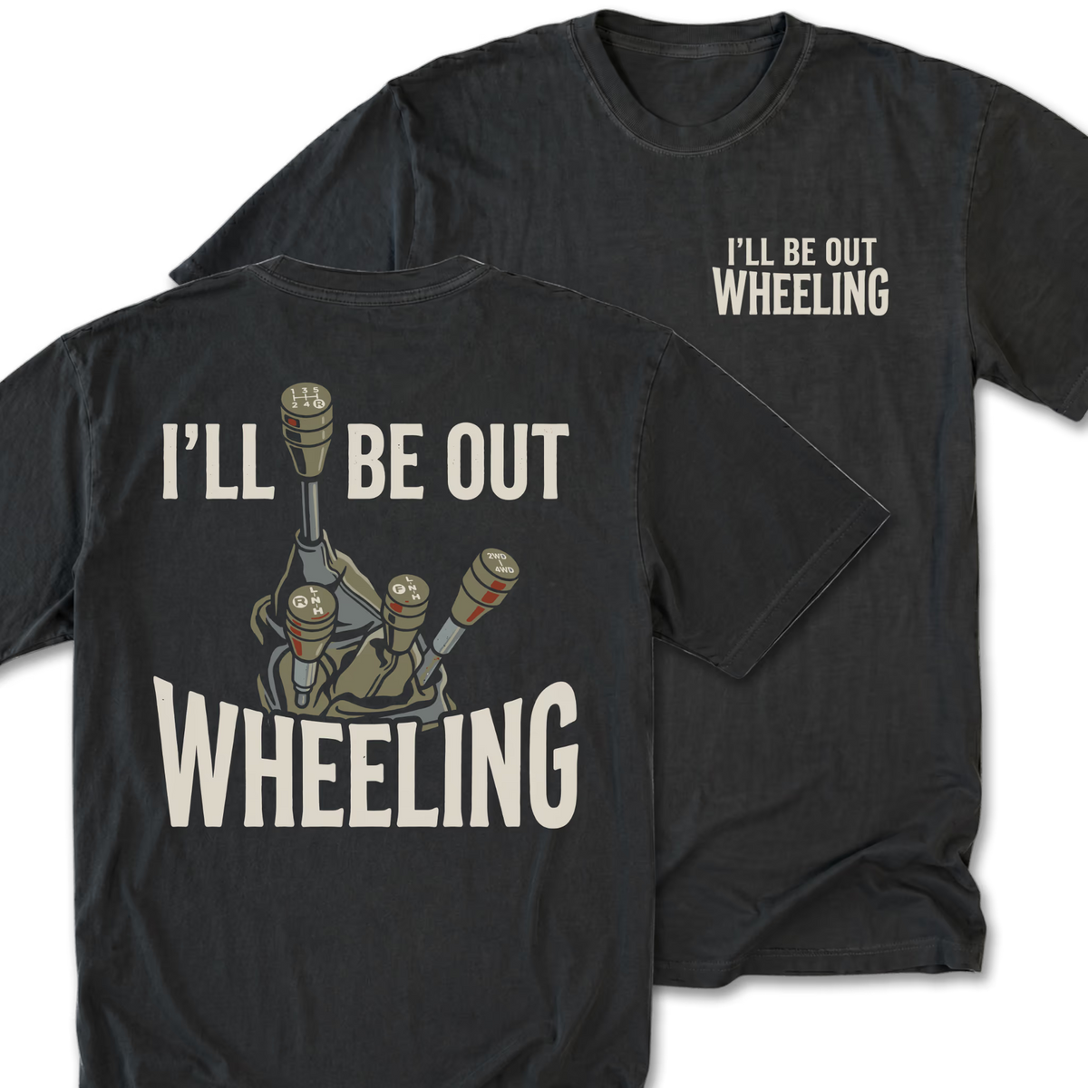 A black t-shirt shown from both the front and back. The front features the phrase 'I'LL BE OUT WHEELING' printed in a distressed off-white font on the left chest.