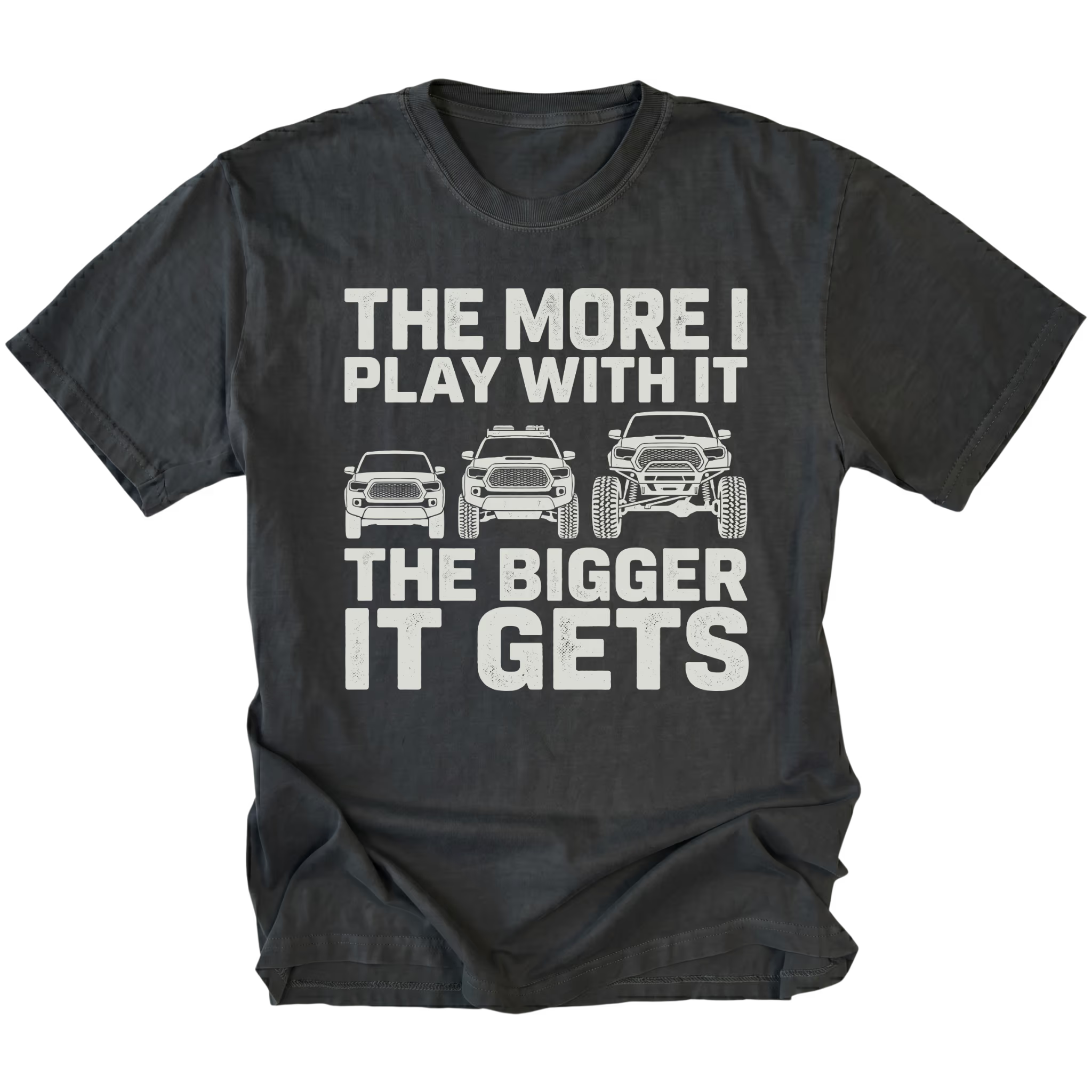 Black T-Shirt featuring The More I Play With It The Bigger It Gets design with three progressively lifted trucks shown on the front view by Trail Snark.