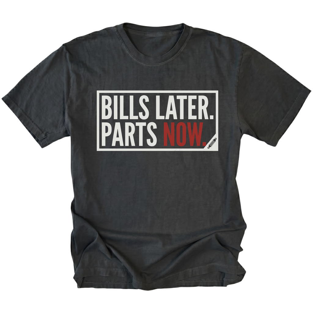 Black t-shirt featuring Bills Later Parts Now design in bold lettering on front view by Trail Snark.