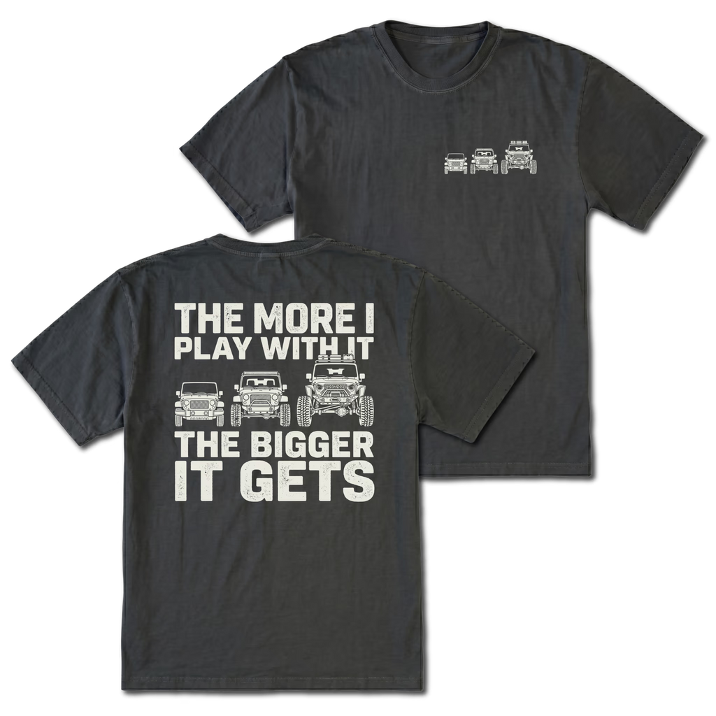 Black T-shirt with The More I Play With It The Bigger It Gets Jeep build design shown from the back view by Trail Snark.