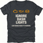 Black t-shirt with dashboard warning icons and the text Ignore Dash Lights Loud Noises Mean It’s Working, front view by Trail Snark.