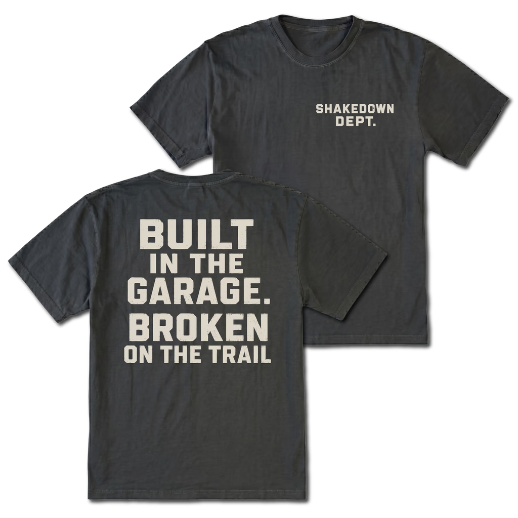 Black T-shirt with Shakedown Dept front print and Built in the Garage Broken on the Trail back design shown front and back by Trail Snark.