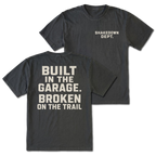 Black T-shirt with Shakedown Dept front print and Built in the Garage Broken on the Trail back design shown front and back by Trail Snark.