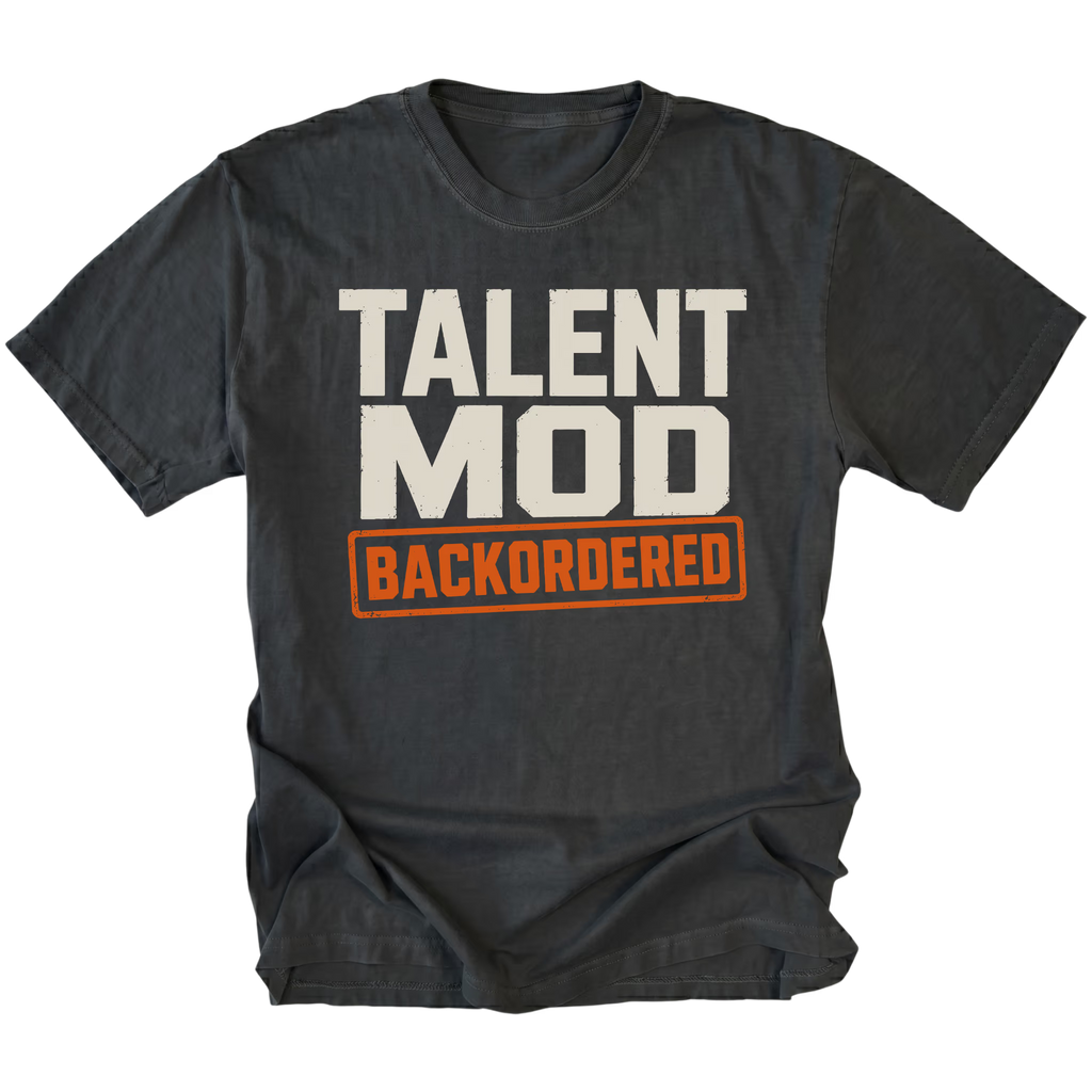 Black T-shirt featuring the Backordered Talent design on the front by Trail Snark.