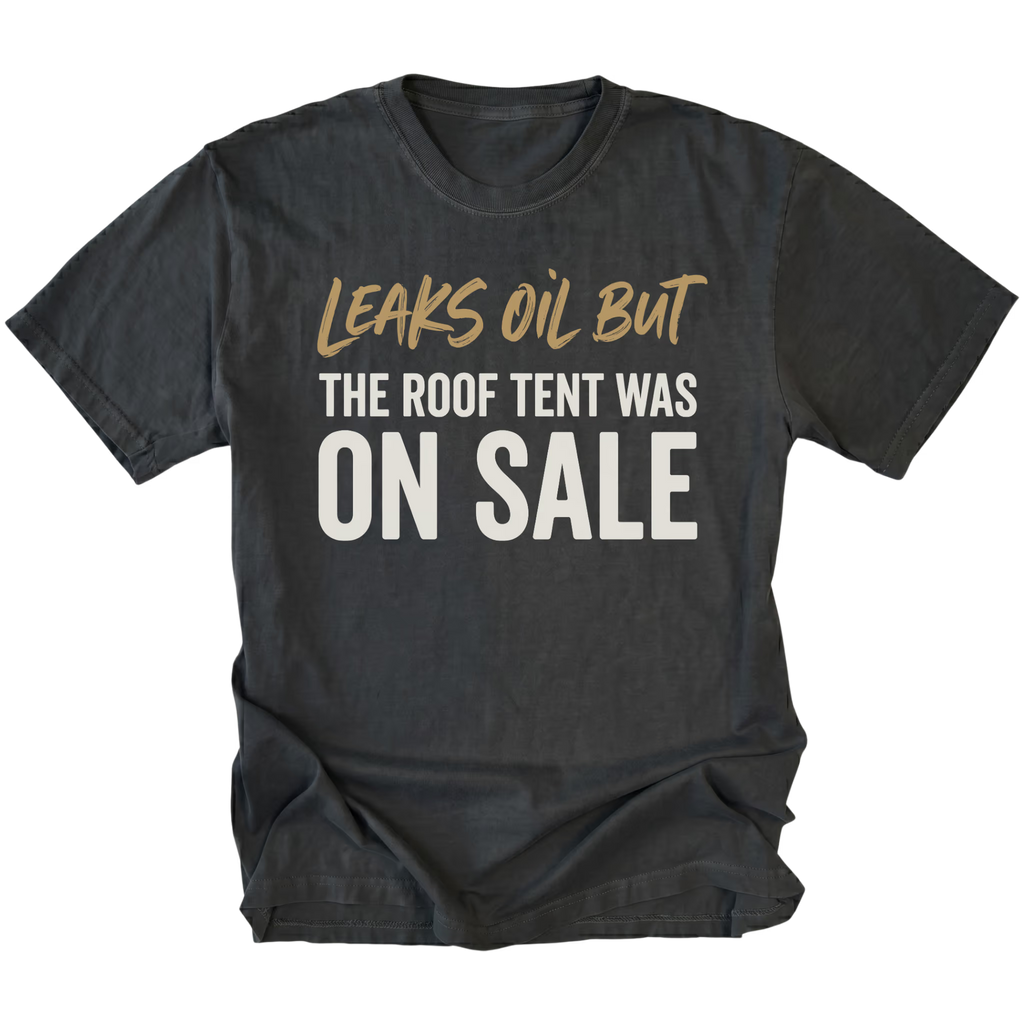 Black T-Shirt featuring the Leaks Oil But The Roof Tent Was On Sale design on the front view by Trail Snark.