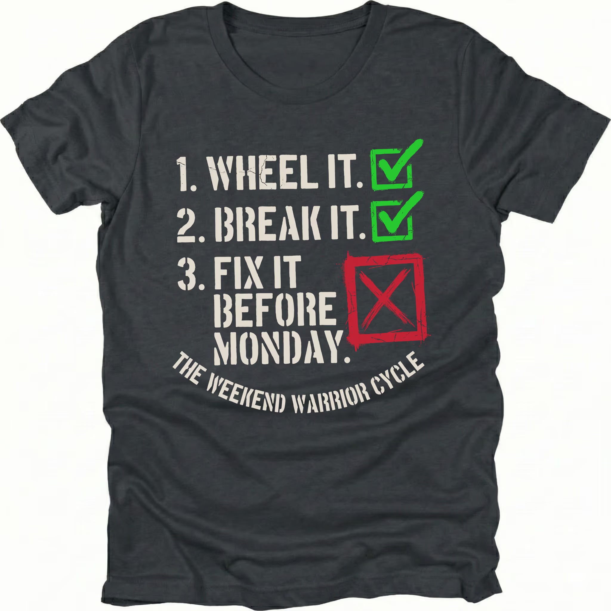 Black t-shirt with checklist text reading “1. Wheel It. 2. Break It. 3. Fix It Before Monday” with checkmarks and a red X, labeled “The Weekend Warrior Cycle.”