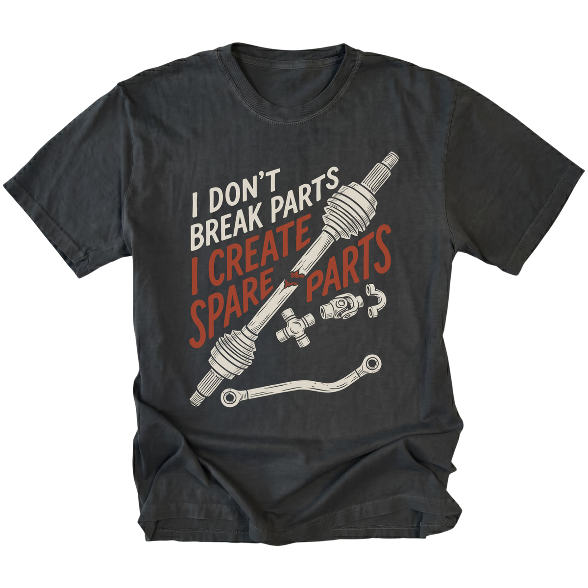 A black graphic t-shirt featuring a humorous design with the text 'I DON'T BREAK PARTS I CREATE SPARE PARTS' in white and orange, accompanied by illustrations of car steering column and brake line components.