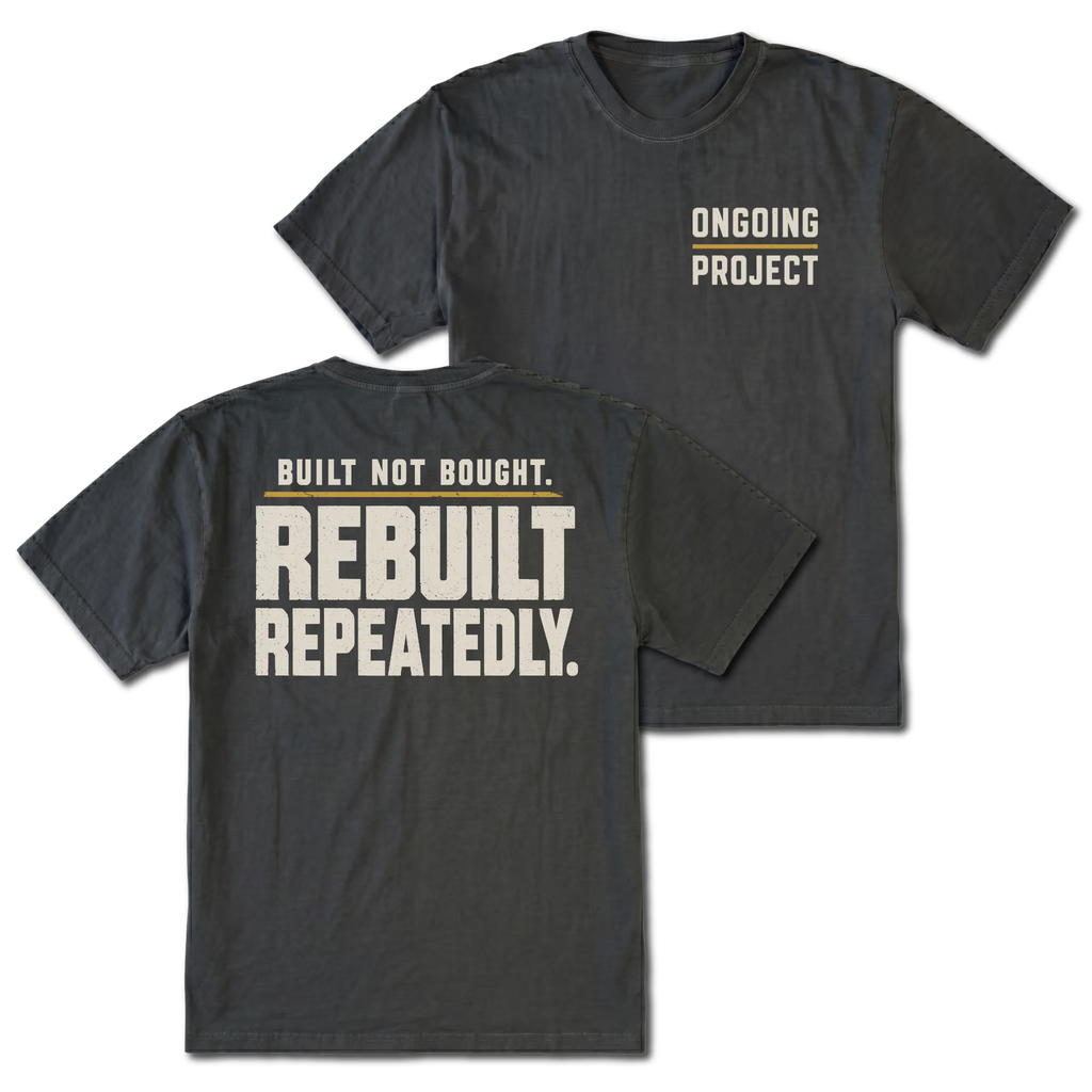 Black T-Shirt with Ongoing Project front design and Built Not Bought Rebuilt Repeatedly back design shown by Trail Snark.