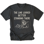 Black T-Shirt with hand-drawn tire and rocks graphic and text reading “The Line Looked Better Standing There” shown on front view by Trail Snark.