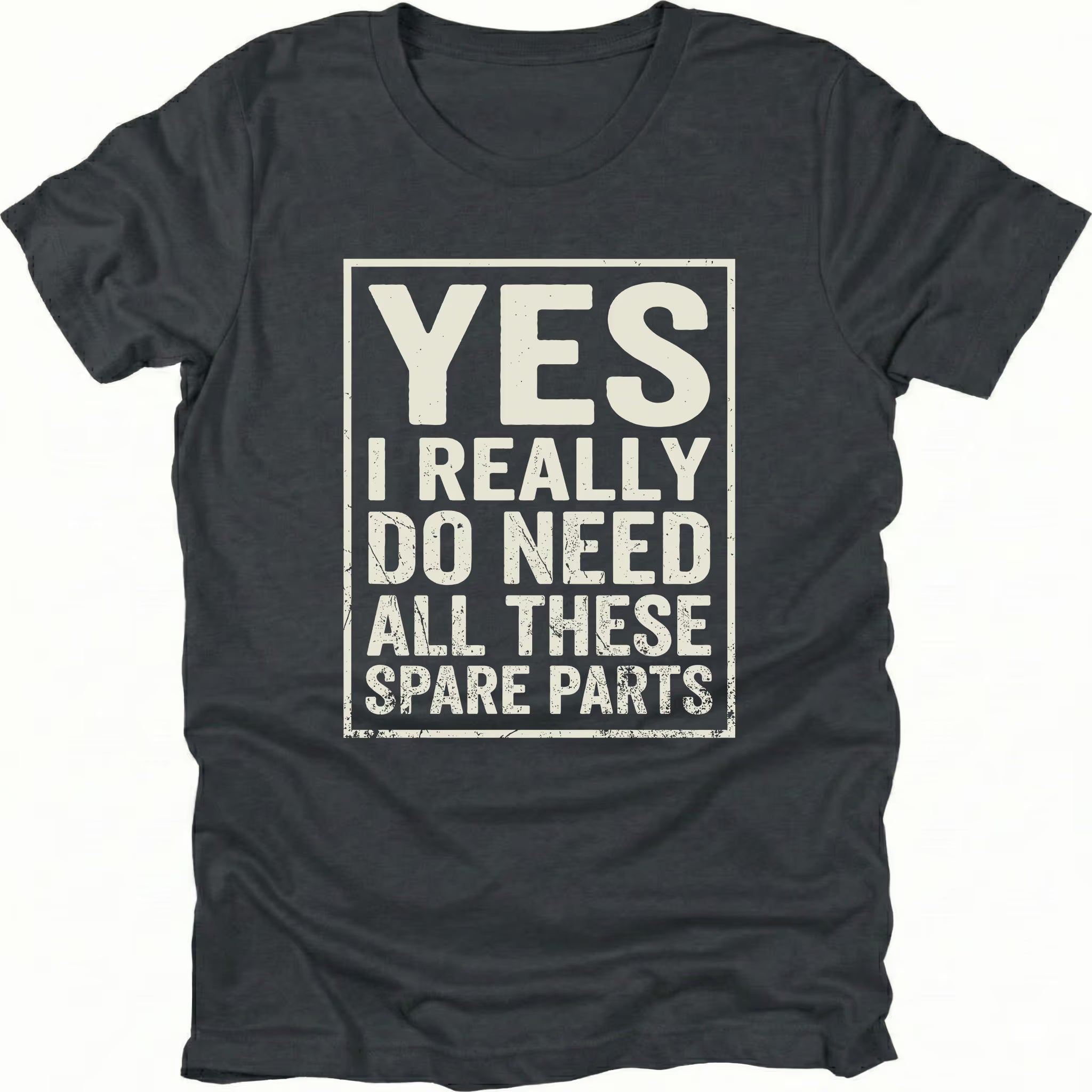 Black t-shirt with bold distressed text reading “Yes I Really Do Need All These Spare Parts” in a boxed layout on the front by Trail Snark.