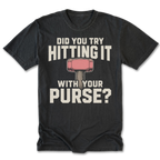 A black t-shirt with a humorous graphic print. The design features the text 'DID YOU TRY HITTING IT WITH YOUR PURSE?' in a distressed off-white font, with a pink and gray purse-shaped hammer illustration in the center.