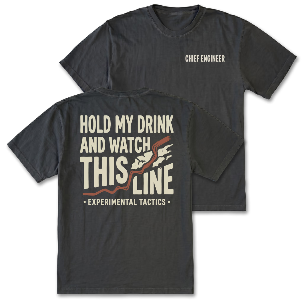 Two black t-shirts shown on a white background, displaying both the front and back designs. The front shirt features the text 'CHIEF ENGINEER' in white on the left chest. The back features the text 'HOLD MY DRINK AND WATCH THIS LINE' and smaller text 'EXPERIMENTAL TACTICS' under.