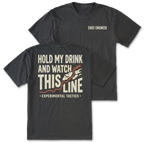 Two black t-shirts shown on a white background, displaying both the front and back designs. The front shirt features the text 'CHIEF ENGINEER' in white on the left chest. The back features the text 'HOLD MY DRINK AND WATCH THIS LINE' and smaller text 'EXPERIMENTAL TACTICS' under.