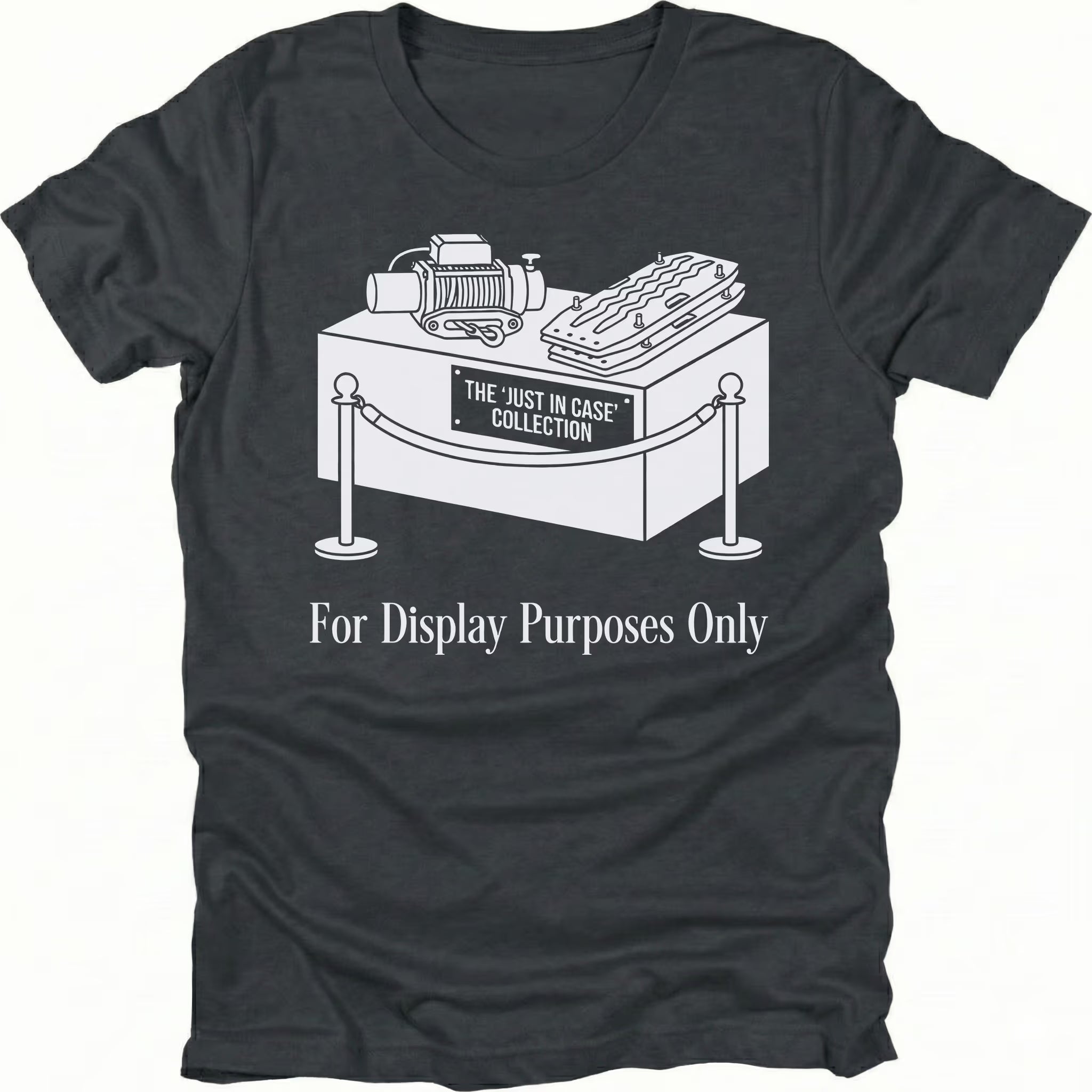 Black t-shirt featuring a display stand graphic labeled the just in case collection with off-road gear and for display purposes only text shown from the front.