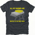 Black t-shirt featuring an all my savings are bolted to the roof rack vehicle gear graphic shown from the front by Trail Snark.