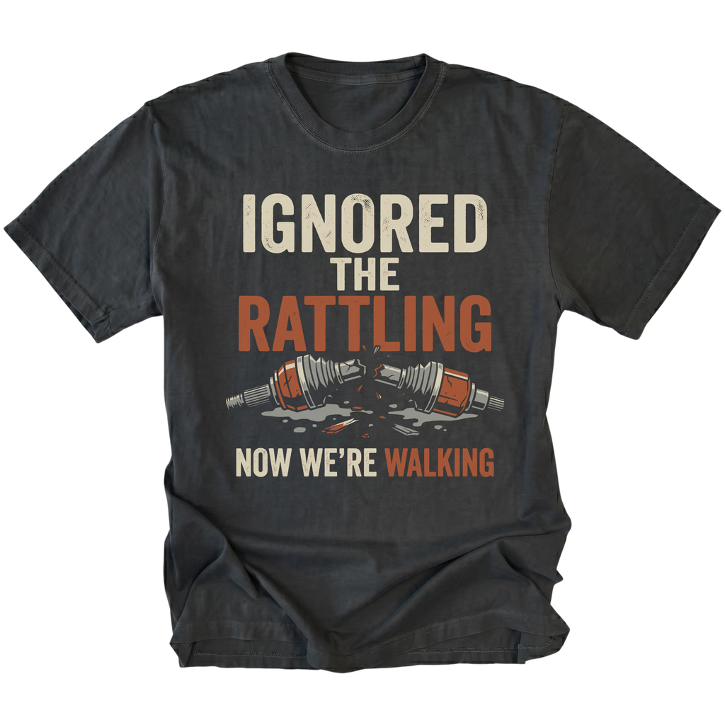 Black T-Shirt with “Ignored The Rattling Now We’re Walking” broken axle design shown on front view by Trail Snark.