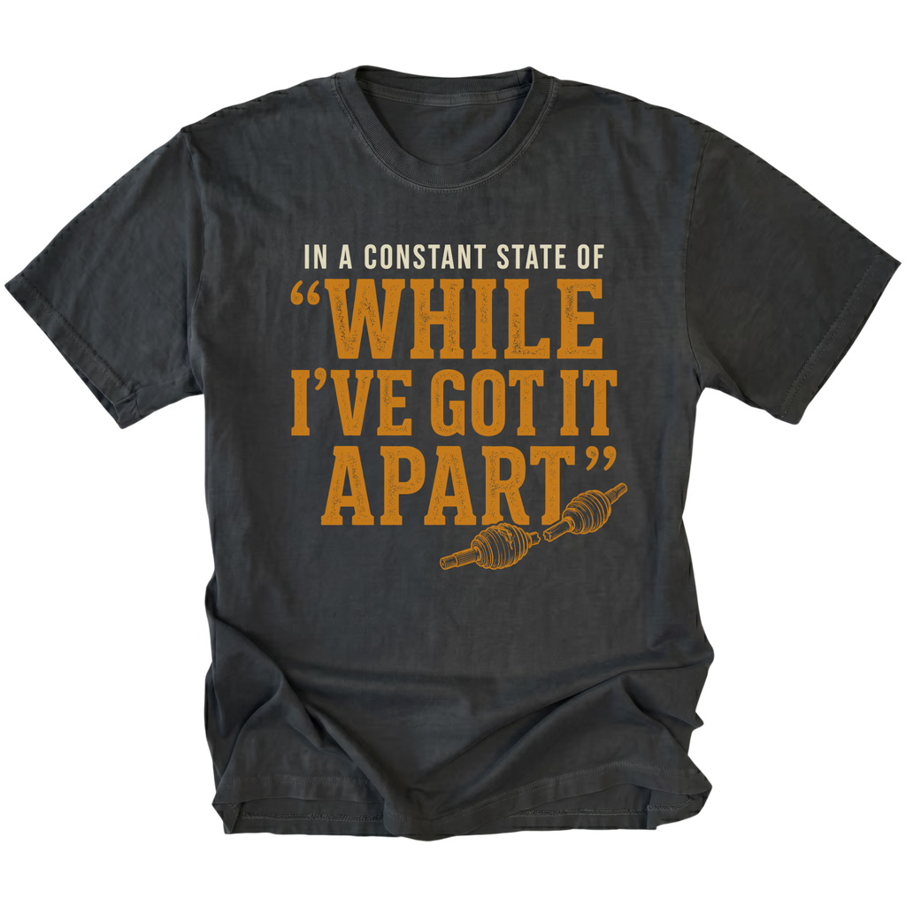 Black T-shirt with a While I've Got It Apart off-road repair design shown from the front by Trail Snark.