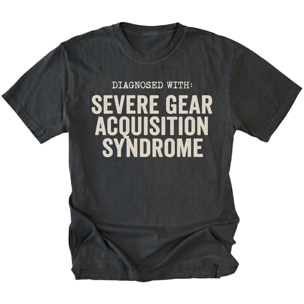 Black t-shirt featuring diagnosed with severe gear acquisition syndrome bold text graphic shown from the front by Trail Snark.