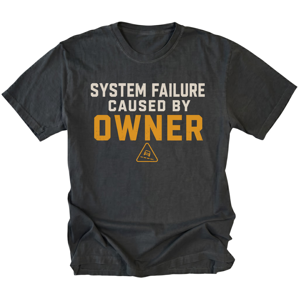 Black T-Shirt featuring the System Failure Caused By Owner design on the front by Trail Snark.