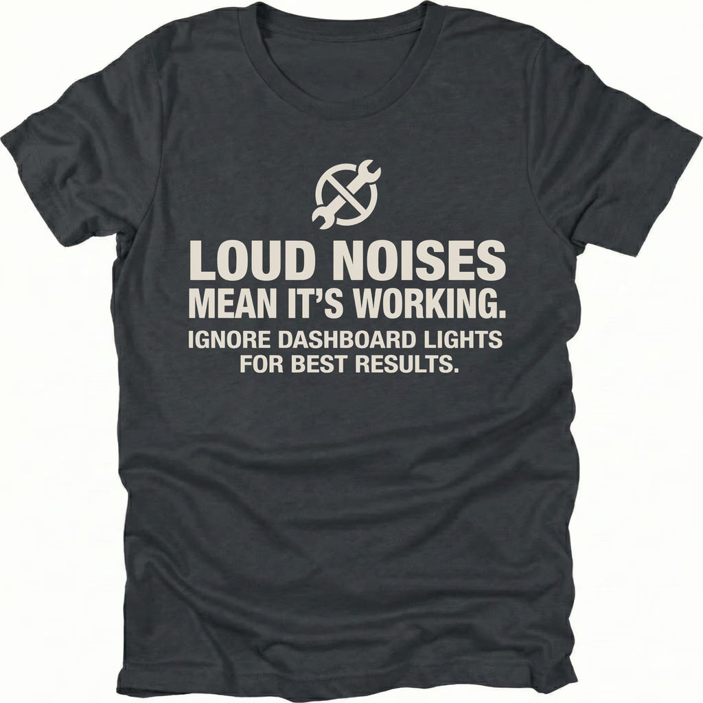 Black t-shirt with wrench icon and text reading Loud Noises Mean It’s Working Ignore Dashboard Lights for Best Results, front view by Trail Snark.