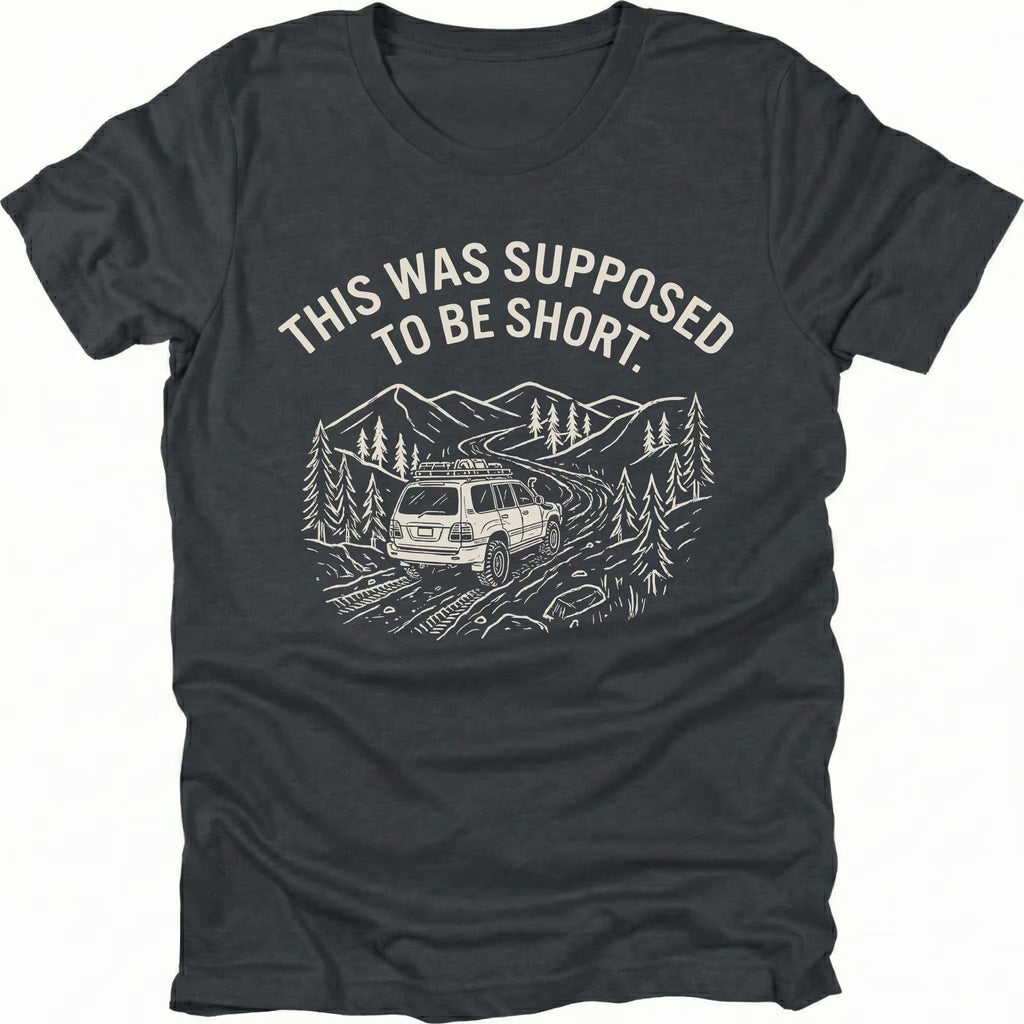 Black t-shirt with text reading “This Was Supposed to Be Short” above an illustration of an SUV driving a winding forest trail through mountains.