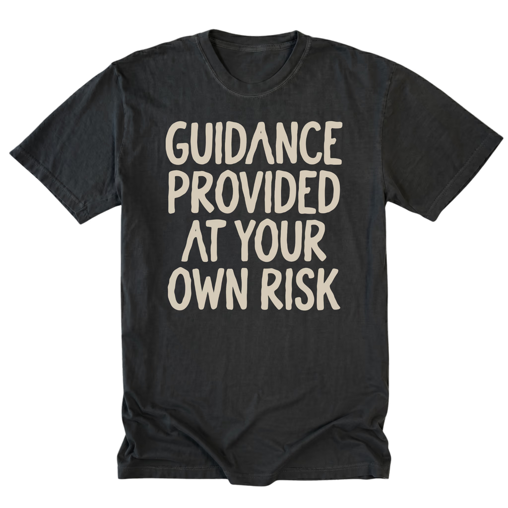 A black tall t-shirt featuring the text 'GUIDANCE PROVIDED AT YOUR OWN RISK'.