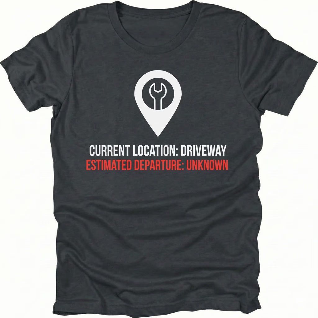 Black t-shirt featuring current location driveway estimated departure unknown graphic shown from the front by Trail Snark.