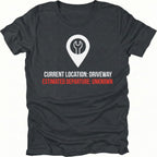 Black t-shirt featuring current location driveway estimated departure unknown graphic shown from the front by Trail Snark.