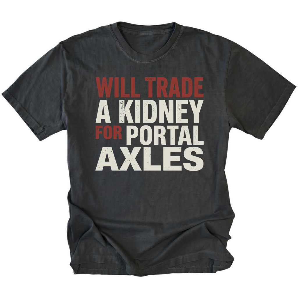 Black T-Shirt featuring Will Trade A Kidney For Portal Axles text design in bold typography on front view by Trail Snark.
