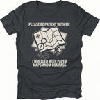 Black T-Shirt with paper map and compass graphic reading “Please Be Patient With Me I Wheeled With Paper Maps And A Compass” shown on front view by Trail Snark.