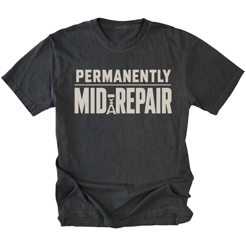 Black T-Shirt featuring the Permanently Mid-Repair design shown in front view by Trail Snark.
