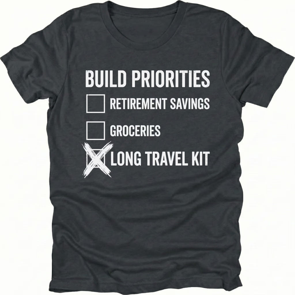 Black T-Shirt featuring Build Priorities checklist highlighting long travel kit on front view by Trail Snark.