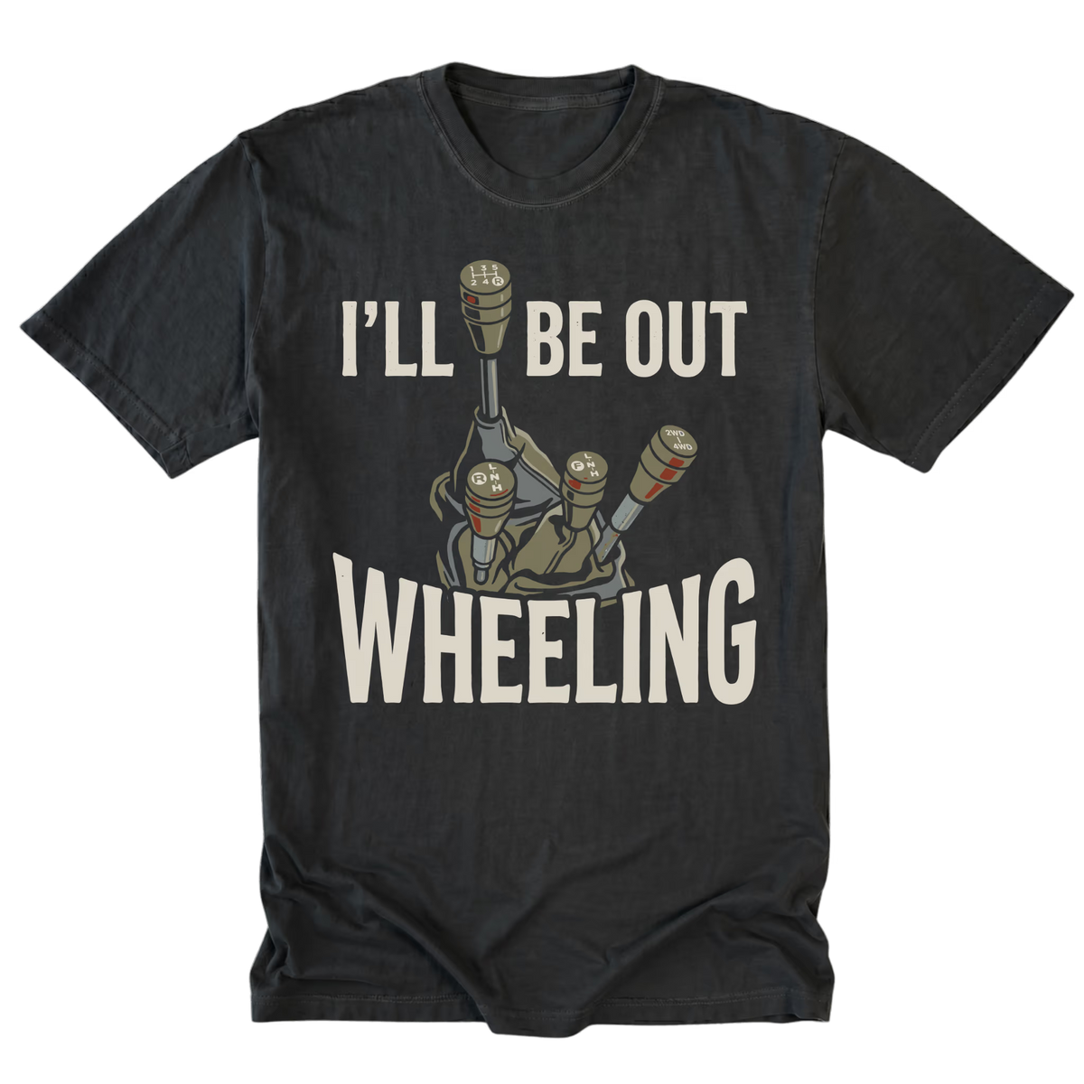 A black t-shirt with a graphic of a manual gear shift console and the text 'I'LL BE OUT WHEELING' in a distressed off-white font, displayed on a solid white background.
