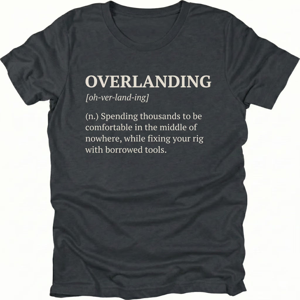 Black T-Shirt with dictionary-style “Overlanding” definition about fixing rigs with borrowed tools shown on front view by Trail Snark.
