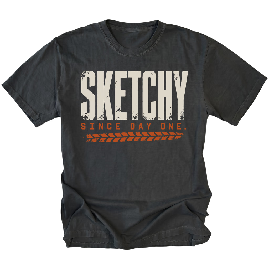 Black T-shirt featuring the Sketchy Since Day One design on the front by Trail Snark.