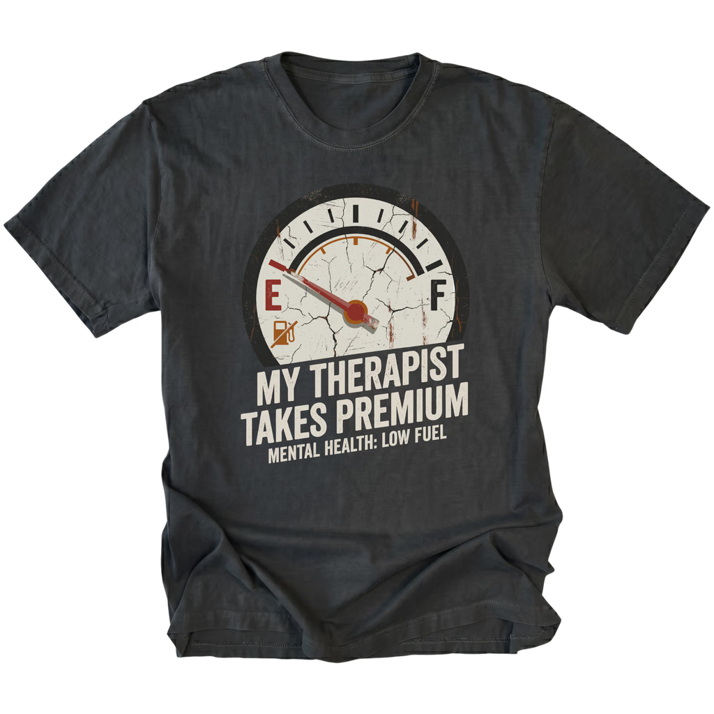 Black t-shirt with distressed fuel gauge graphic pointing near empty and text reading My Therapist Takes Premium with Mental Health Low Fuel by Trail Snark.