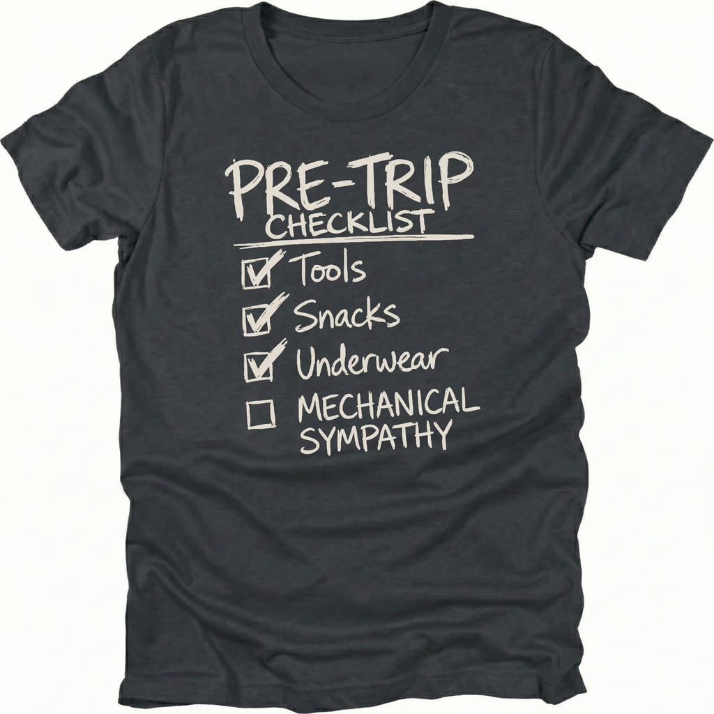 Black T-Shirt with handwritten-style pre trip checklist reading tools snacks underwear and mechanical sympathy shown on front view by Trail Snark.