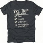 Black T-Shirt with handwritten-style pre trip checklist reading tools snacks underwear and mechanical sympathy shown on front view by Trail Snark.