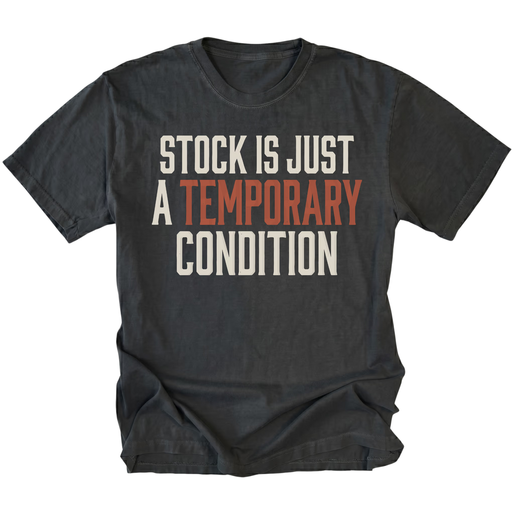 A black graphic t-shirt with the text 'STOCK IS JUST A TEMPORARY CONDITION' printed on the chest. The words 'STOCK IS JUST' and 'CONDITION' are in a cream/off-white color, while 'A TEMPORARY' is in a muted terracotta orange color.