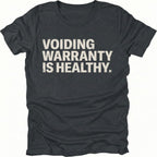 Black t-shirt with bold text reading “Voiding Warranty Is Healthy” printed on the front.
