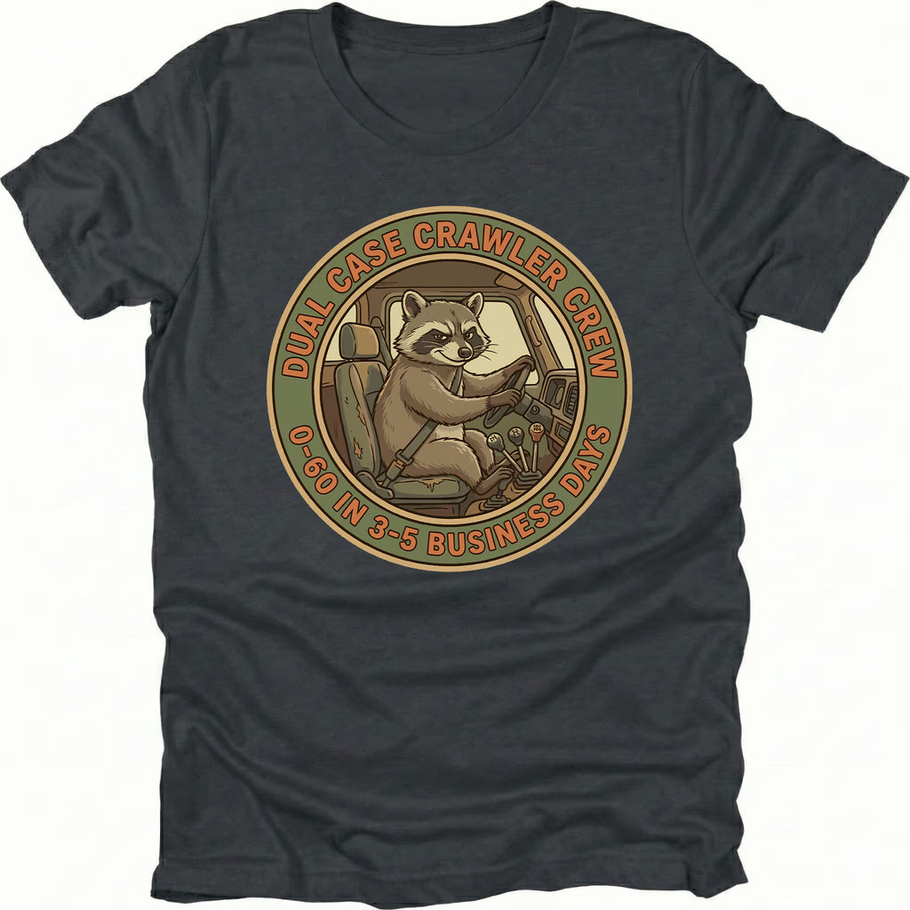Black t-shirt featuring a raccoon driving a crawler with dual case crawler crew circular badge graphic shown from the front by Trail Snark.