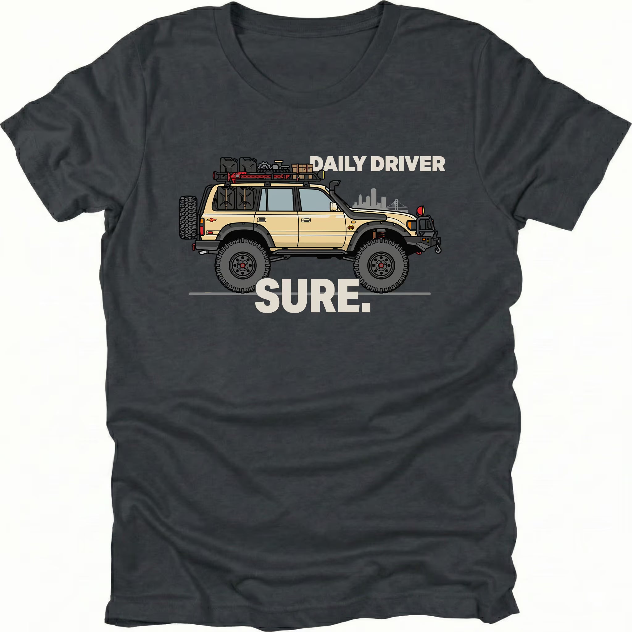 Black t-shirt featuring a built off-road vehicle with daily driver sure text graphic shown from the front by Trail Snark.