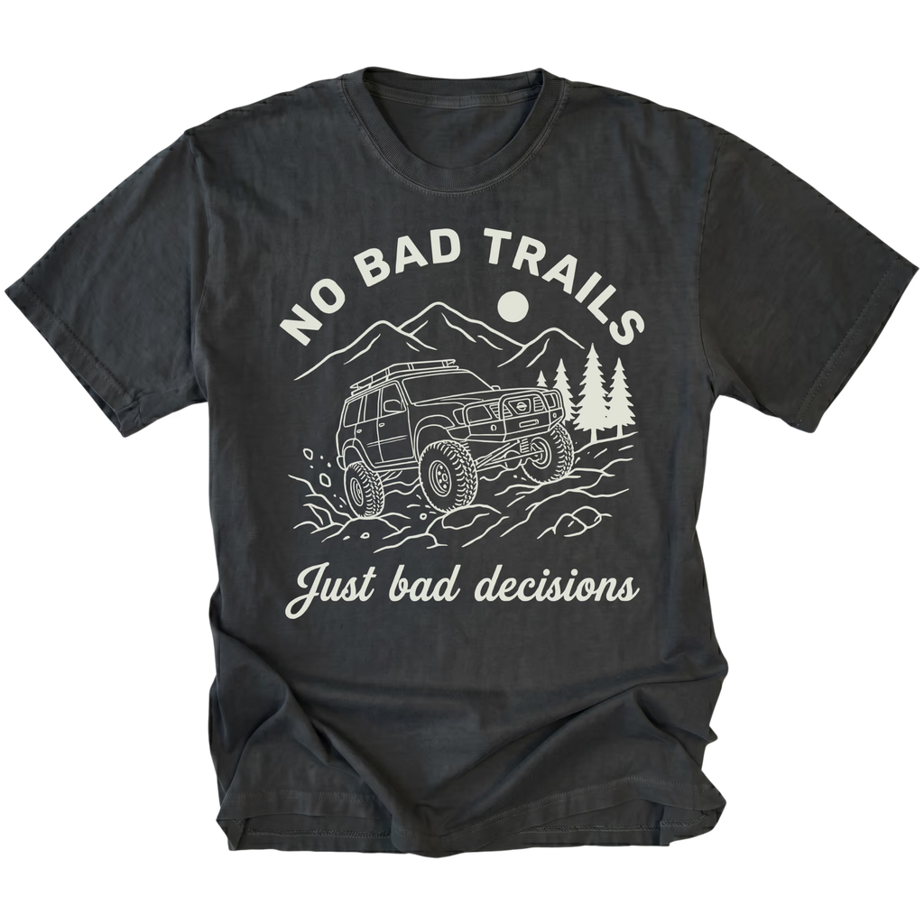 Black t-shirt featuring an off-road SUV climbing rocks with text reading No Bad Trails Just Bad Decisions, front view by Trail Snark.