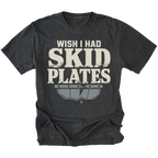 A black t-shirt with a distressed graphic that reads 'WISH I HAD SKID PLATES' in cream lettering above a gray car bumper graphic, shown on a plain white background.