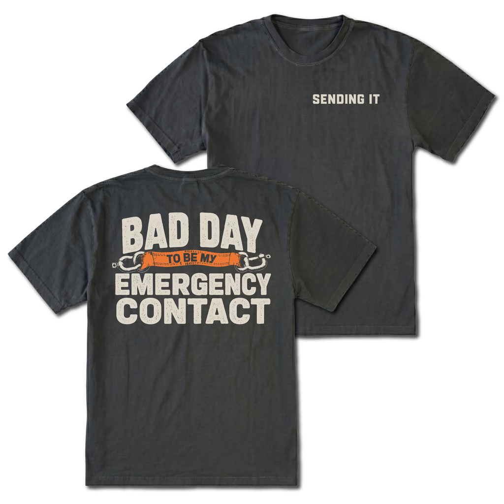 Black t-shirt featuring the Emergency Contact design on the back and Sending It on the front by Trail Snark.