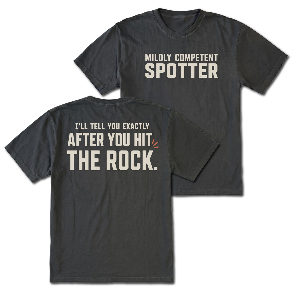 Black t-shirt featuring the Mildly Competent Spotter design on the front and the after you hit the rock design on the back by Trail Snark.