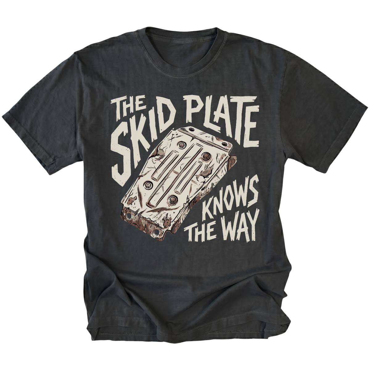 A black graphic t-shirt featuring a distressed cream-colored print of a metal water cooler plate with the text 'THE SKID PLATE KNOWS THE WAY'. The t-shirt is displayed flat against a clean white background.