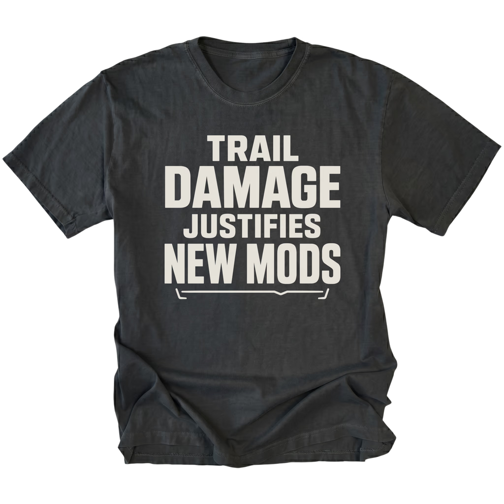 Black T-Shirt featuring the Trail Damage Justifies New Mods design in front view by Trail Snark.