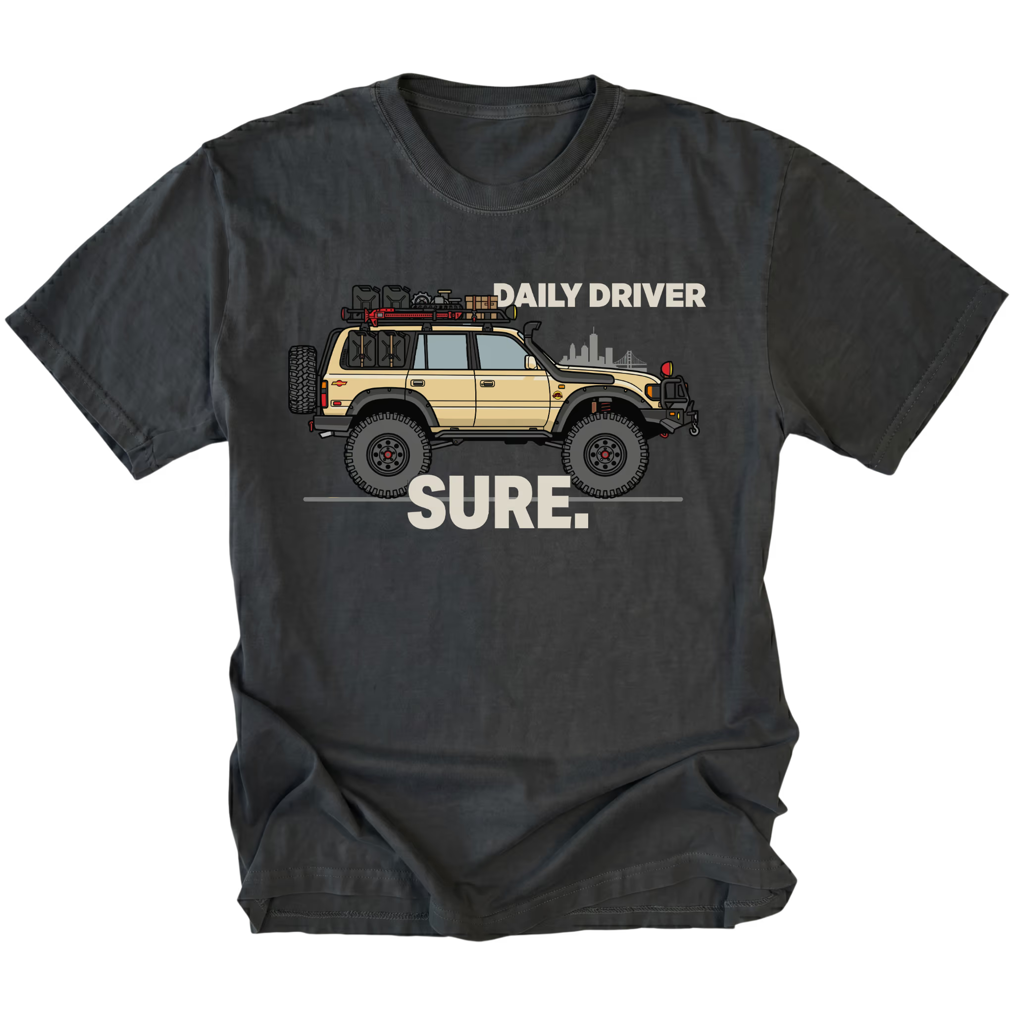 Black t-shirt featuring a built off-road vehicle with daily driver sure text graphic shown from the front by Trail Snark.
