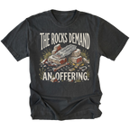 A black graphic t-shirt featuring a vintage-style illustration of a pile of rocks and gold coins with the text 'THE ROCKS DEMAND AN OFFERING.' printed in distressed cream lettering.